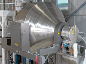 A food processing plant uses this 140 cu ft (4 cu m) capacity, sanitary Rotary Batch Mixer. Complete evacuation allows fast, thorough cleaning between batches with minimal downtime.